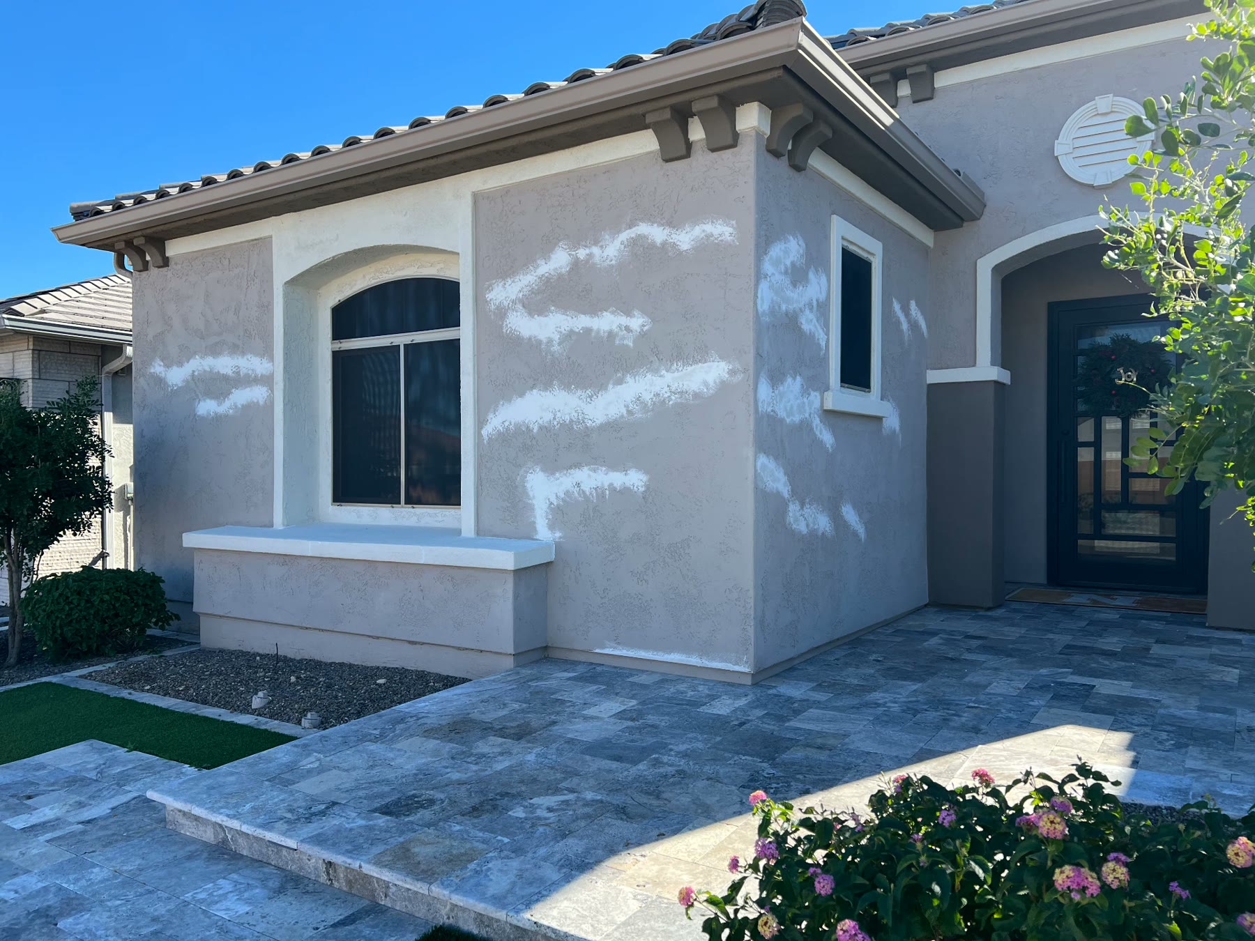 Stucco patched and prepped on a Phoenix home exterior before painting