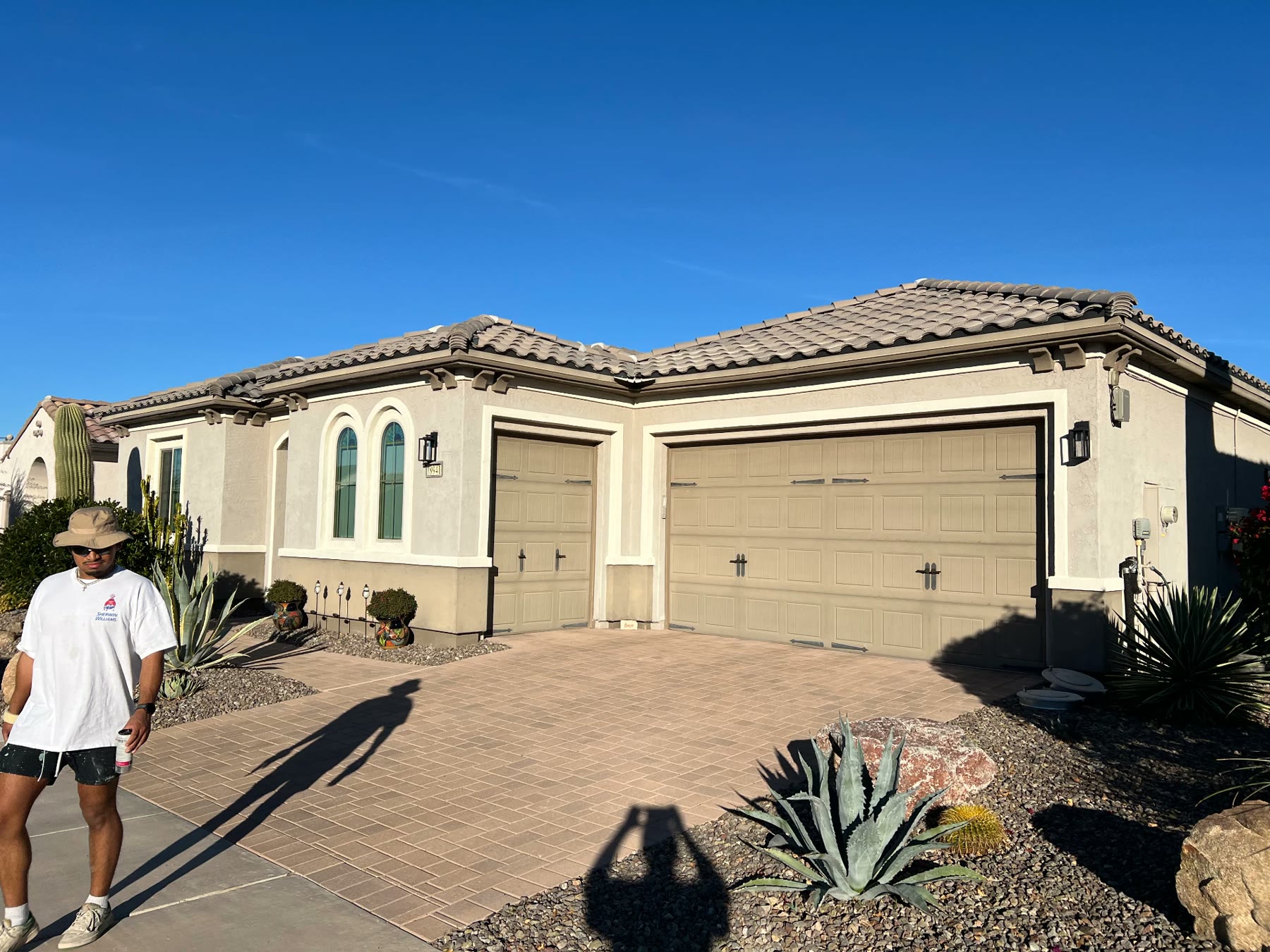 Freshly repainted stucco home exterior with tile roof in Phoenix
