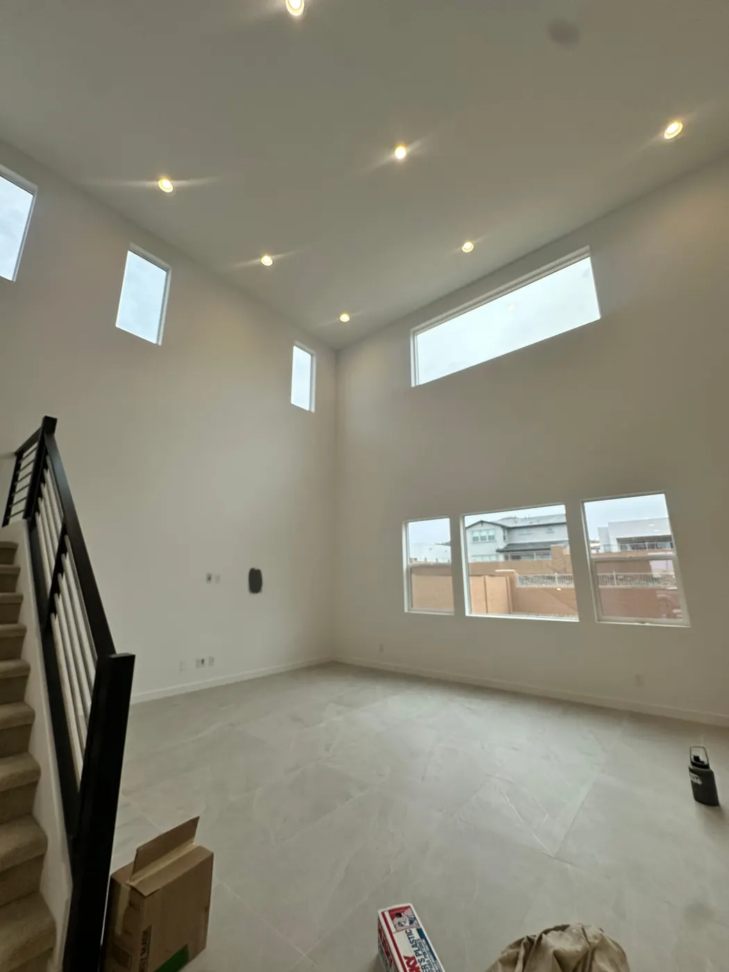 Bright two-story interior freshly painted white with clean trim lines